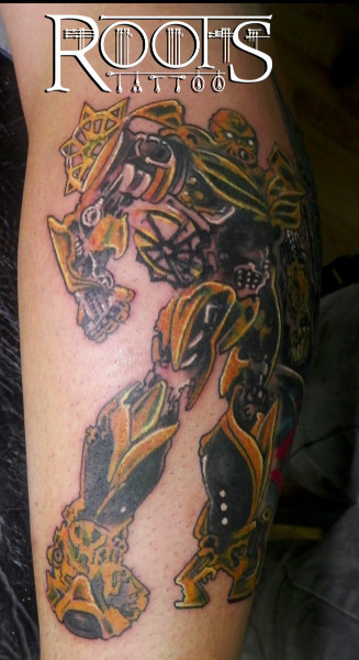 Tatuaje transformer amarillo