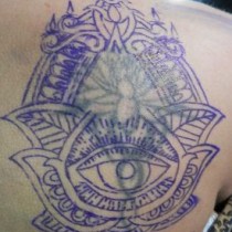 Tapado, arreglo y ampliación de tatuaje antiguo loto