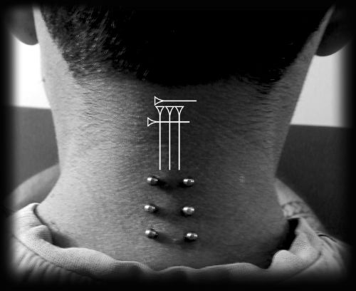 Triple surface piercing Roots Tattoo