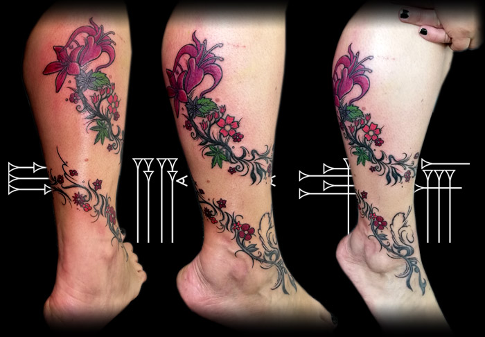 Flowers tattoo on girl leg